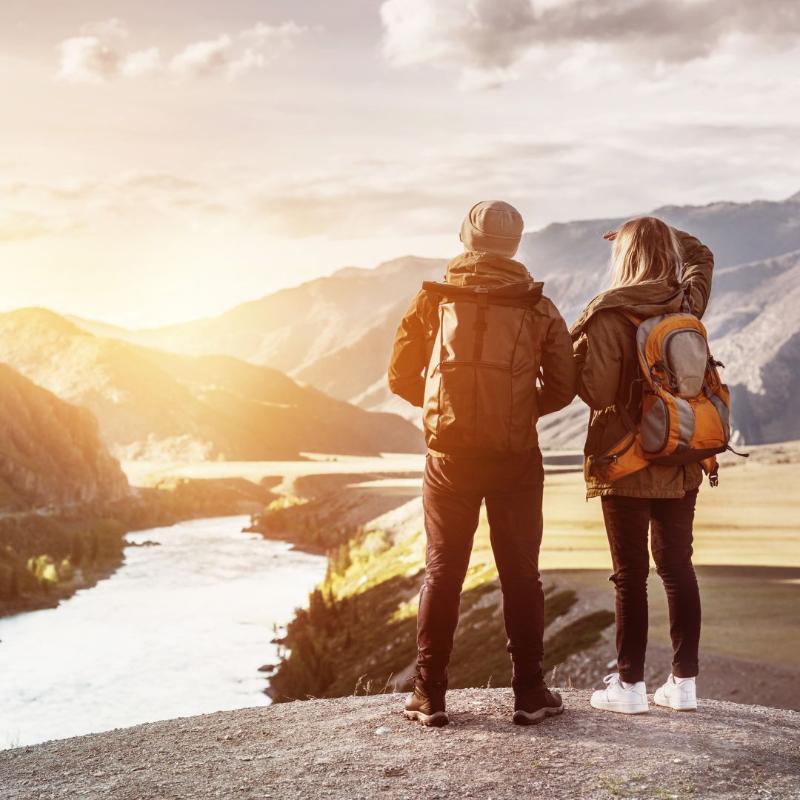 Two People Looking at Mountain